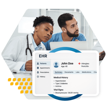 Two healthcare providers reviewing medical history of a patient