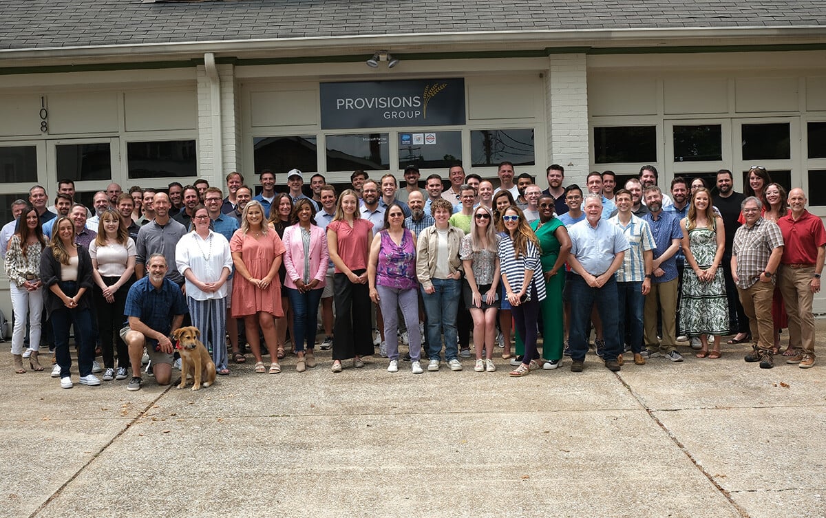 A large group of Provisions Group employees outside the office